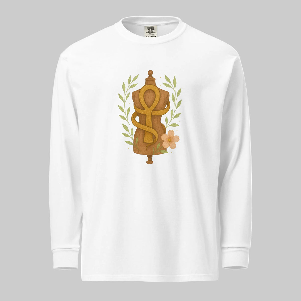 Feminine Form of Power Long Sleeve Crewneck Tee in White, front view, featuring a painterly gold Ankh and dress form with laurel leaves and a peach bloom
