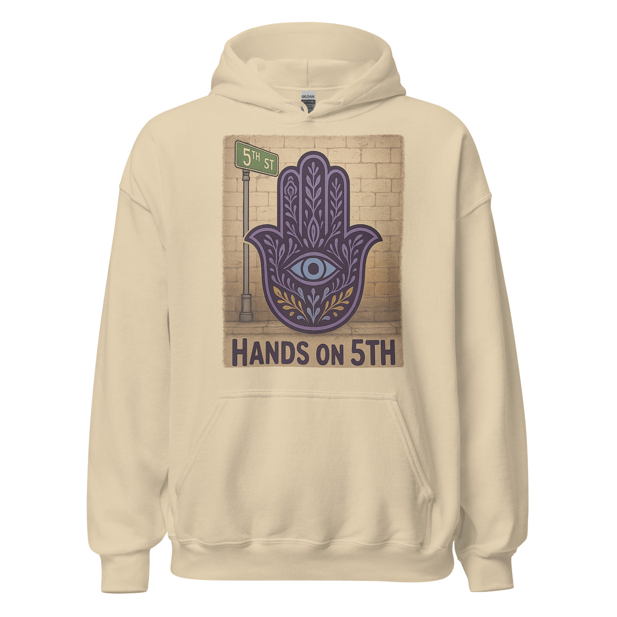 Hands On 5th St Hoodie in Sand with a purple Hamsa beside a 5th St sign, front view