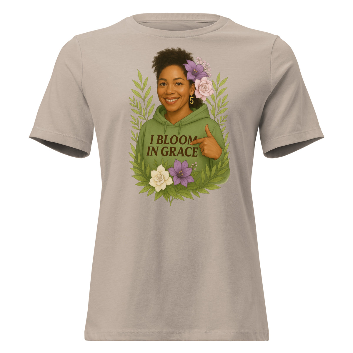 Women's relaxed-fit I Bloom In Grace Exclusive Tee with a smiling woman in a green hoodie framed by flowers and leaves, front view