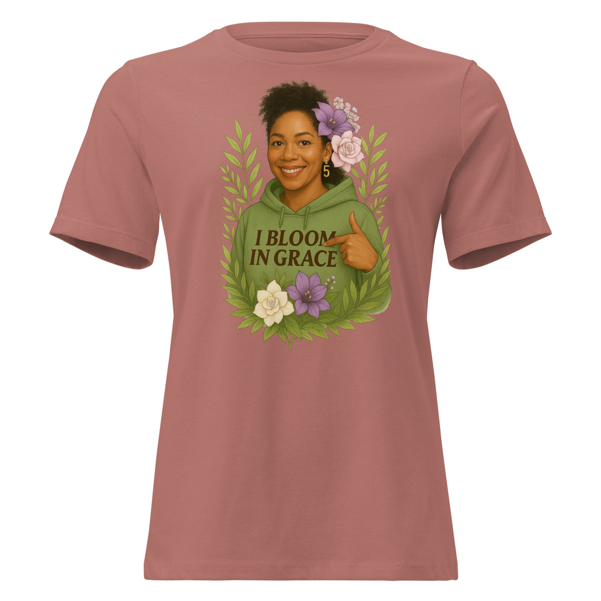 Women's relaxed-fit I Bloom In Grace Exclusive Tee with a smiling woman in a green hoodie framed by flowers and leaves, front view